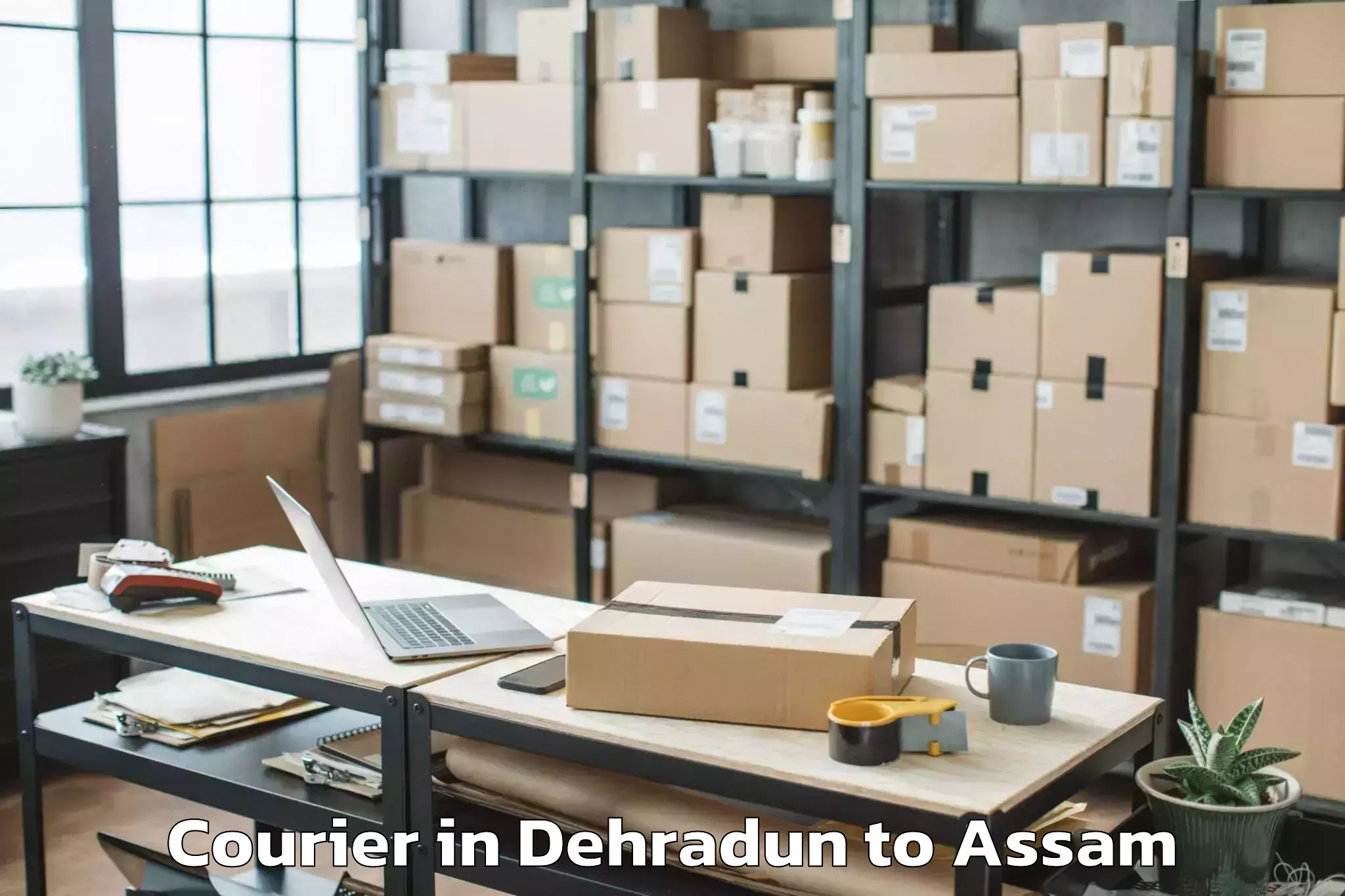 Trusted Dehradun to Dergaon Courier